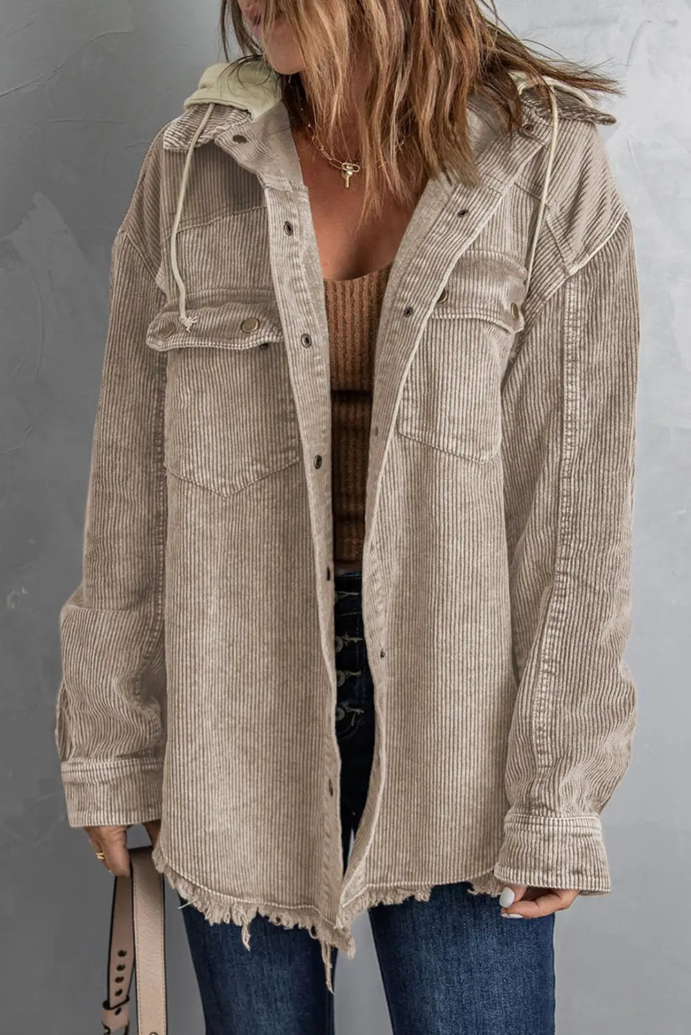 Snap Front Hooded Corduroy Shacket by Trendsi in beige, with frayed hem and front pockets.