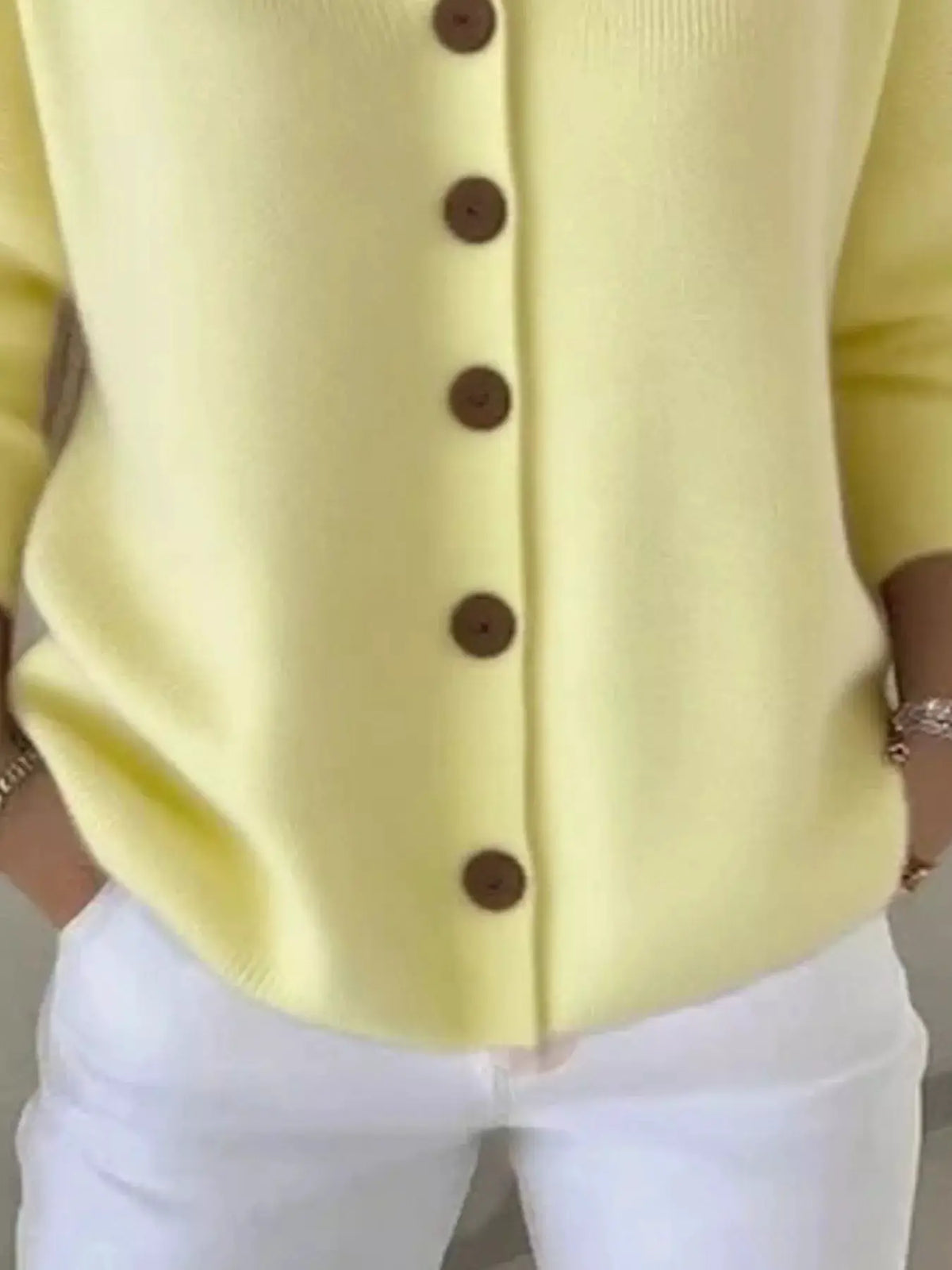 Plus-size hooded button-front soft knit cardigan in pale yellow with brown buttons