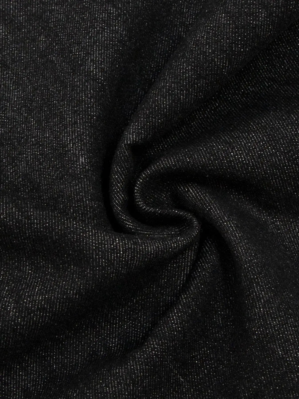 Mens denim shorts fabric close-up in dark wash with speckled cotton blend