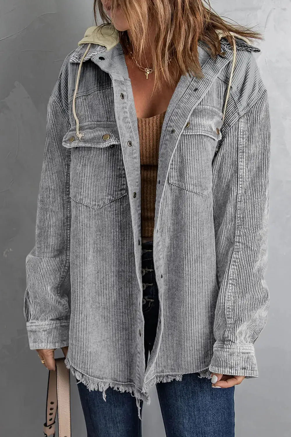 Snap-front hooded corduroy shacket in gray with chest pockets and a frayed hem