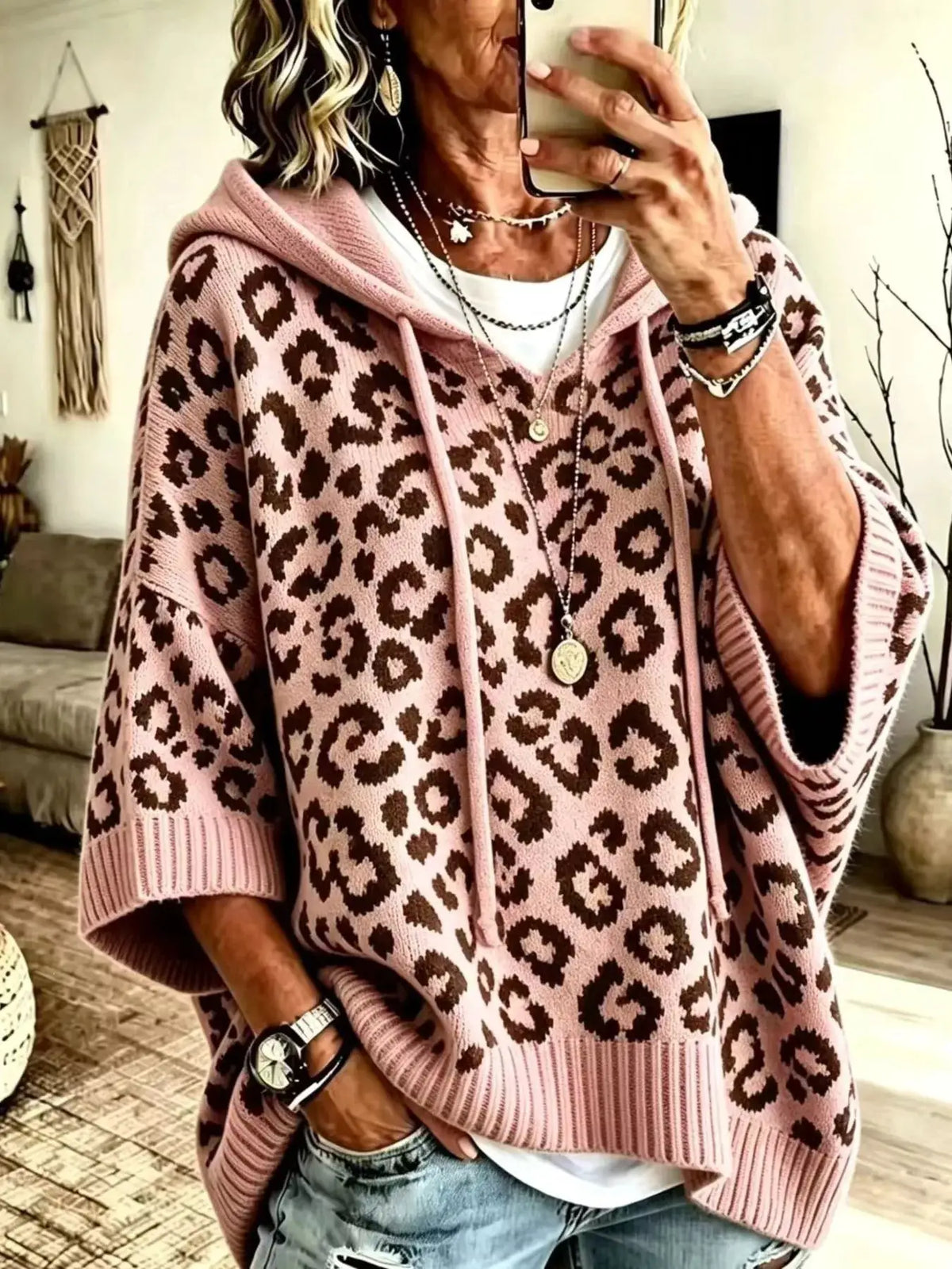 Drawstring leopard hooded sweater in pink knit with brown leopard print; relaxed fit.