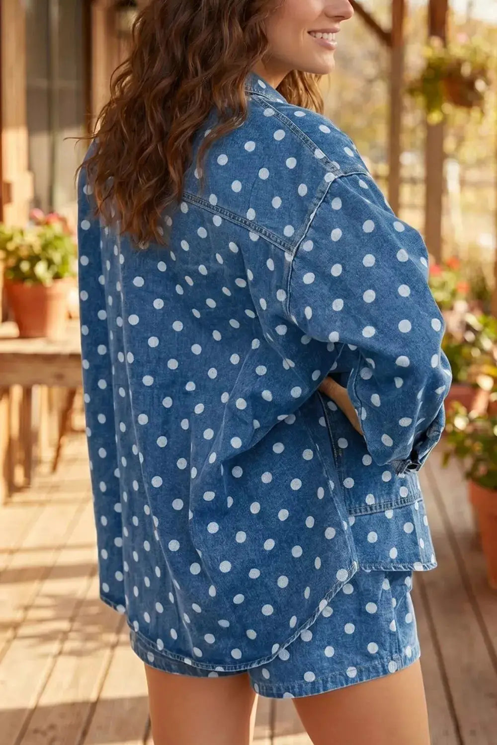 Polka dot blue denim long-sleeve tunic jacket with utility pockets and button closure