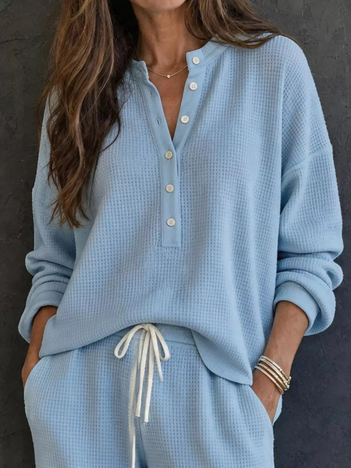 Waffle-knit henley top and matching light-blue wide-leg pants set by Trendsi