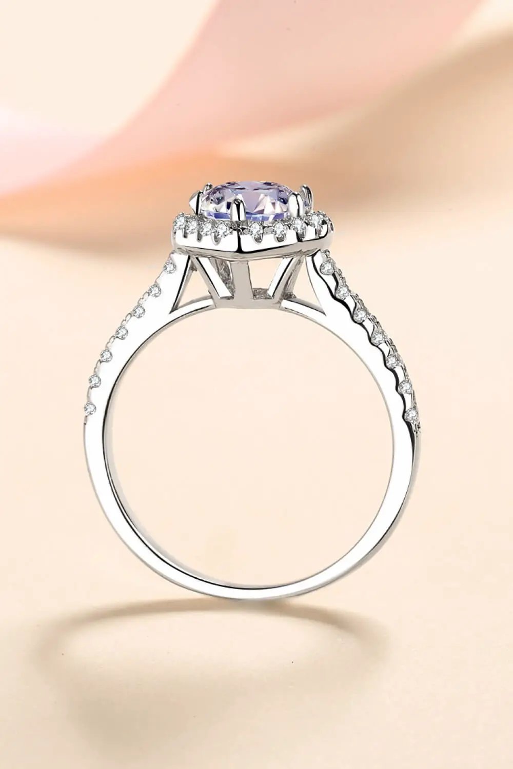 1 Carat Moissanite Heart-Shaped Ring in white gold with pavé halo and diamond-accent band.