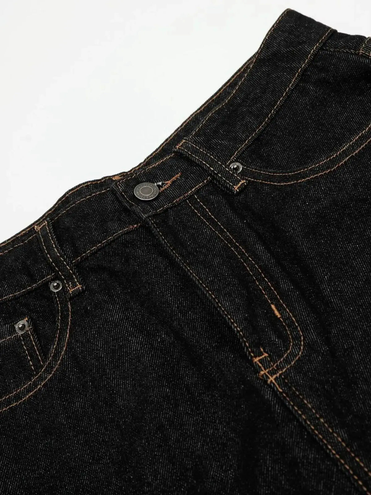 Men's relaxed baggy denim shorts in dark indigo with orange contrast stitching and metal rivets.