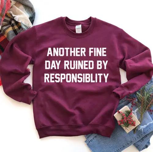 Another Fine Day Sweatshirt, burgundy long-sleeve crewneck with bold white slogan across chest, comfortable pullover.