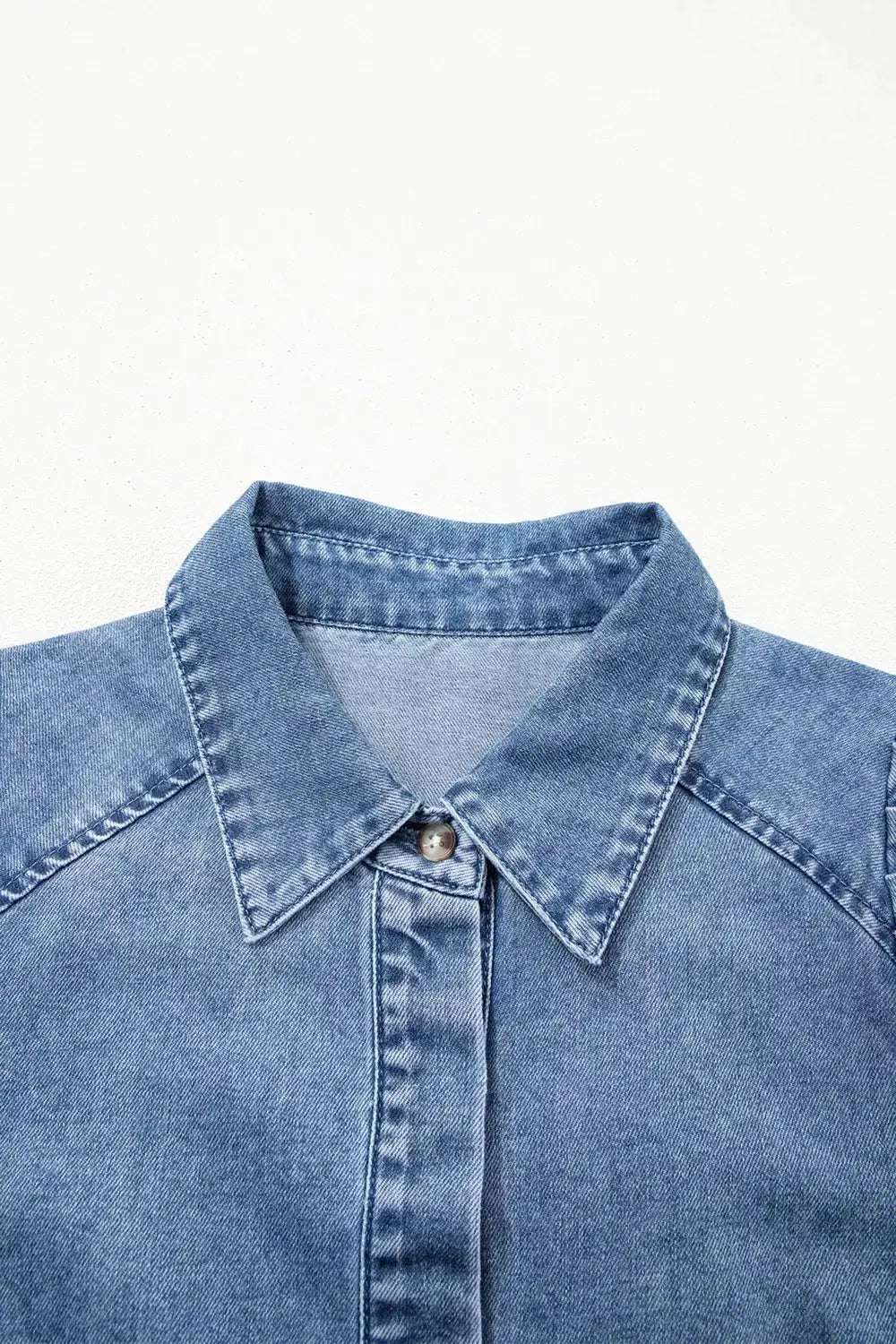 Denim shirt with structured collar in blue cotton-blend fabric.