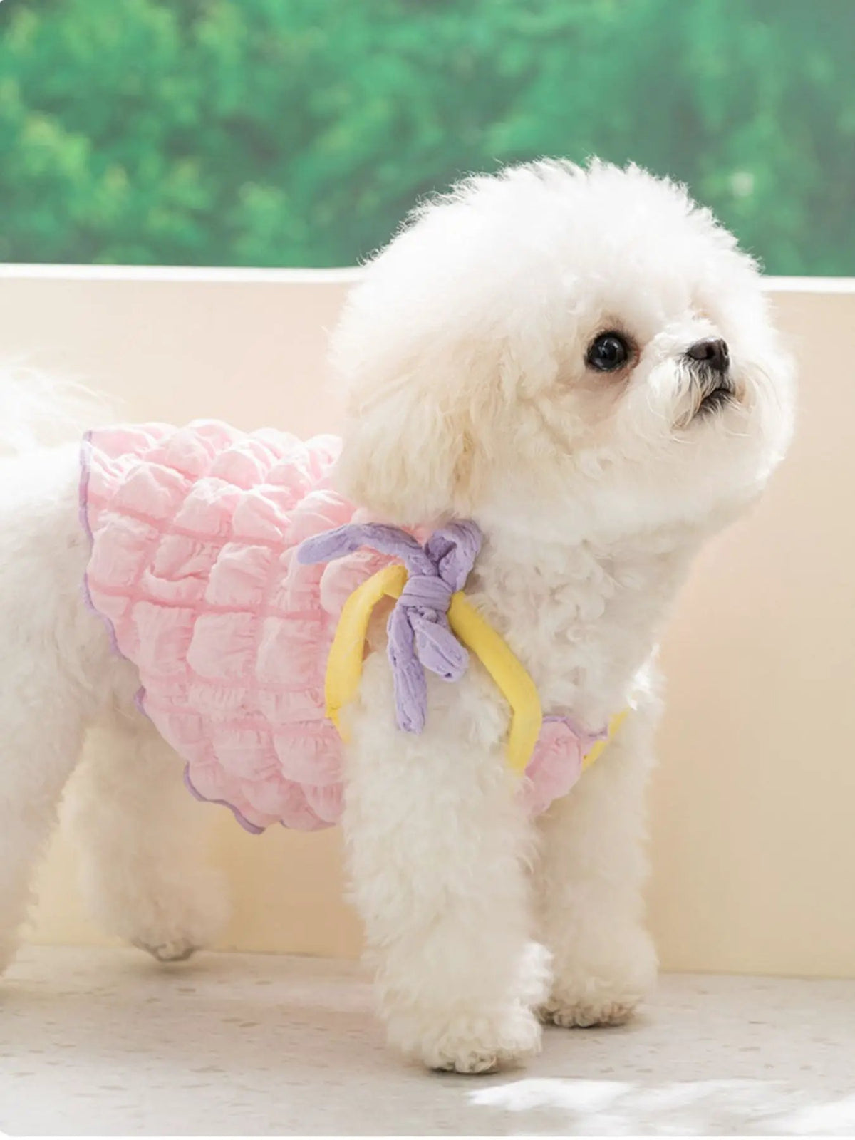 Bubble-textured tie-shoulder pet top in pink with purple and yellow ribbons