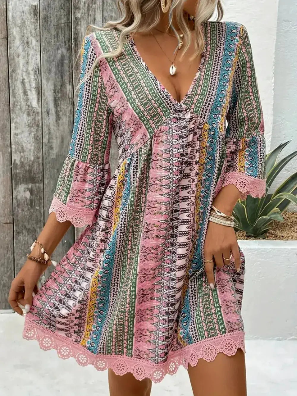 Lace-trim printed v-neck dress with 3/4 sleeves and hem lace trim in pink, green, blue pattern by Trendsi.