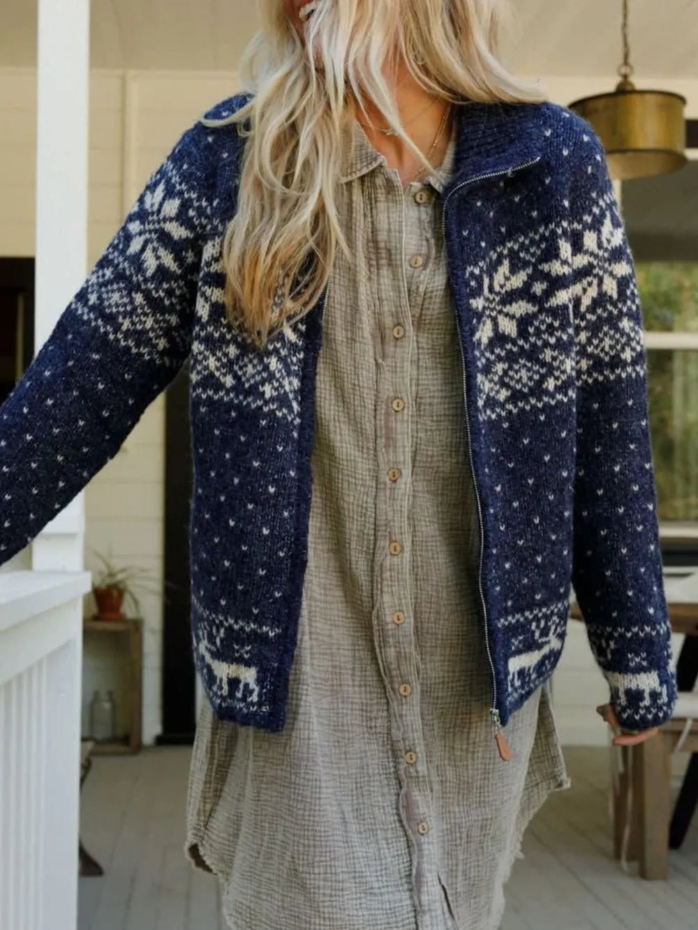 Cozy Zip-Up Long Sleeve Acrylic Cardigan by Trendsi in navy with white Nordic pattern, worn over a beige button-down shirt.