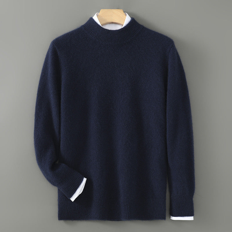 Men's navy knit sweater on hanger with white shirt cuffs peeking.