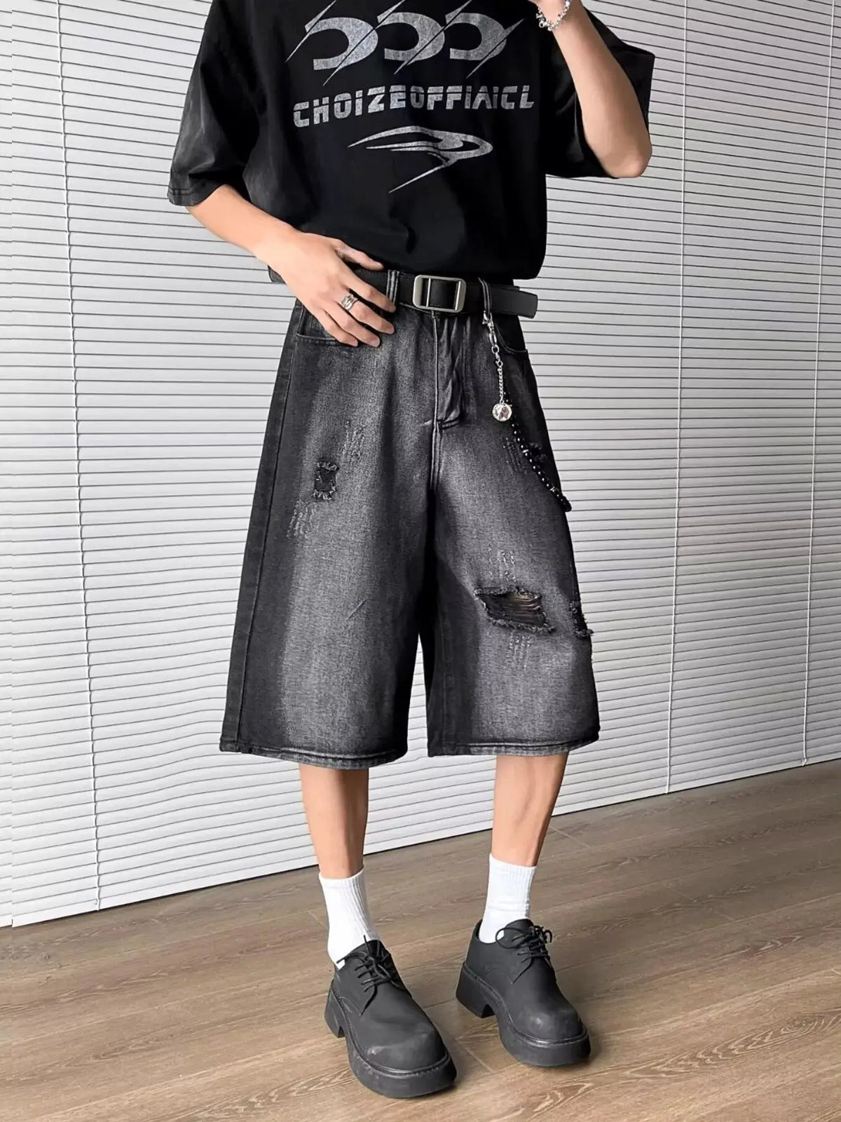 Men's full-size distressed wide-leg denim shorts, dark wash.