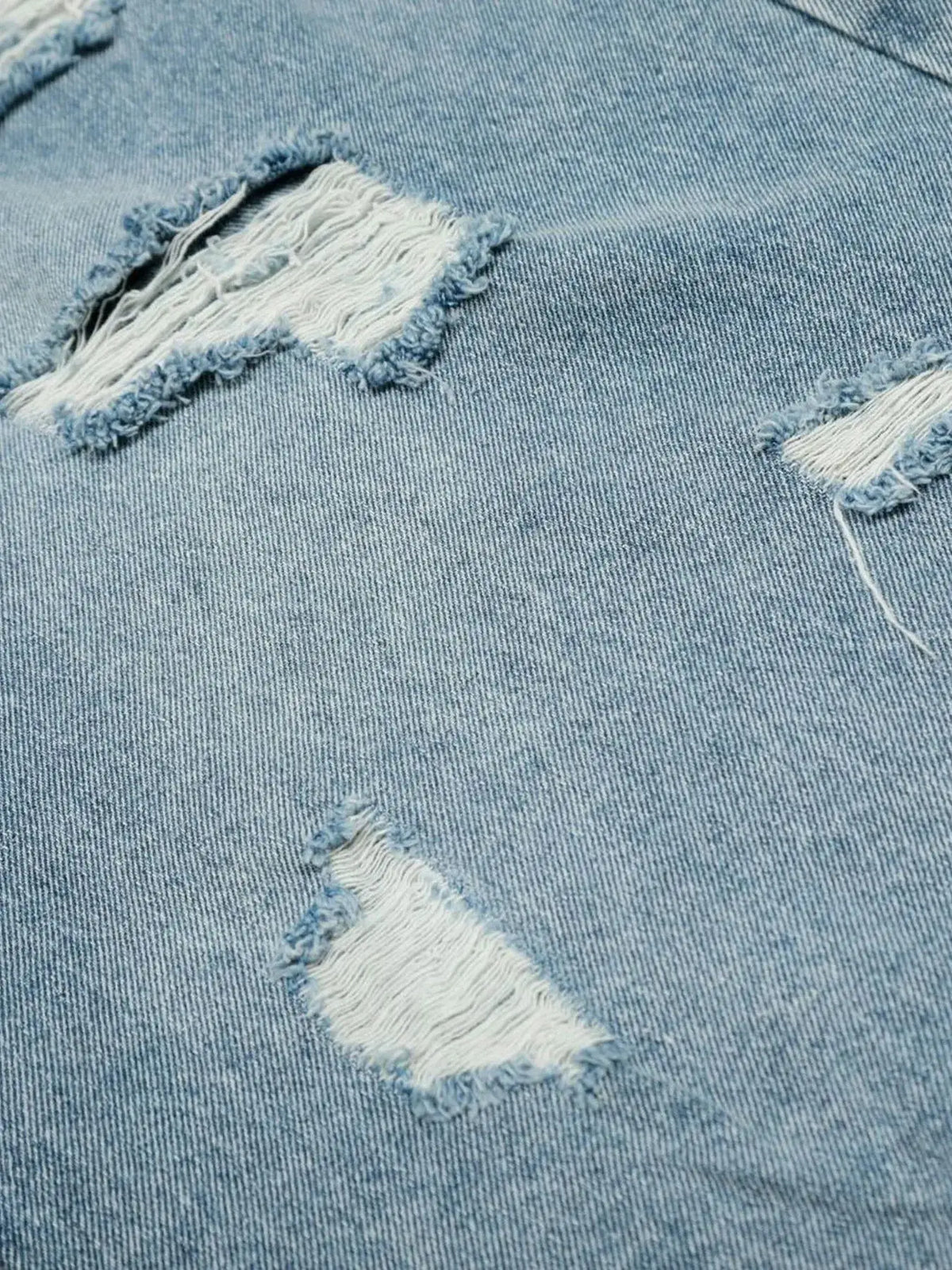 Mens oversized distressed denim shorts in light blue cotton blend by Trendsi