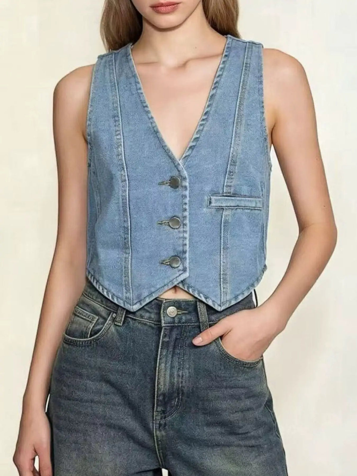 Unlined Button Down Denim Vest by Trendsi; light-wash blue denim, sleeveless with front buttons