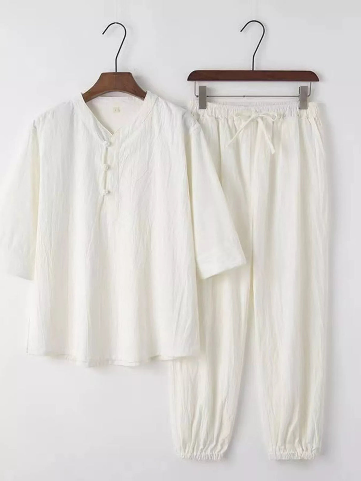 Men's plus-size 3/4-sleeve top and pants set in ivory by Trendsi
