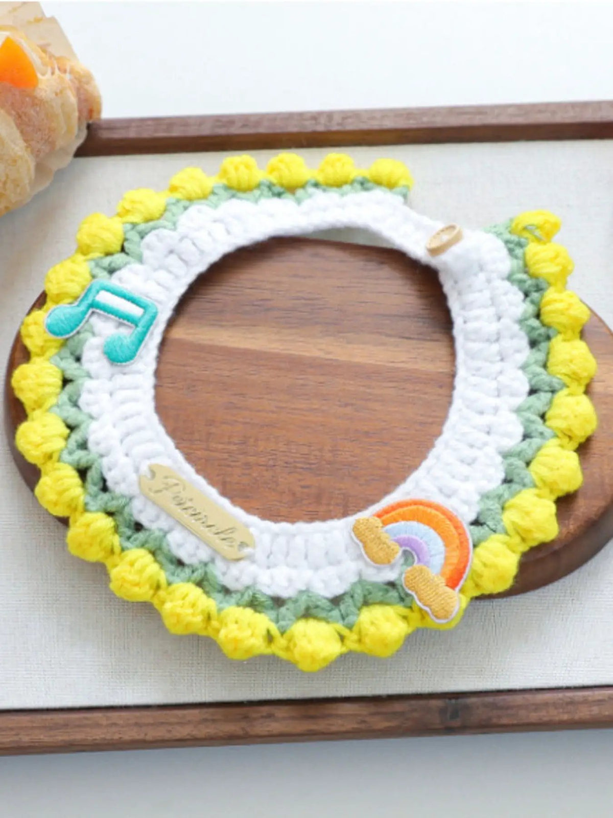 Contrast Pet Scarf by Trendsi, crocheted white center with yellow pom-pom edge and teal accents