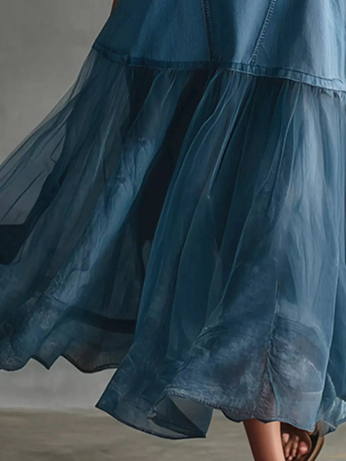 Women's sleeveless tulle denim patchwork dress with stretch panels in blue; voluminous layered skirt.