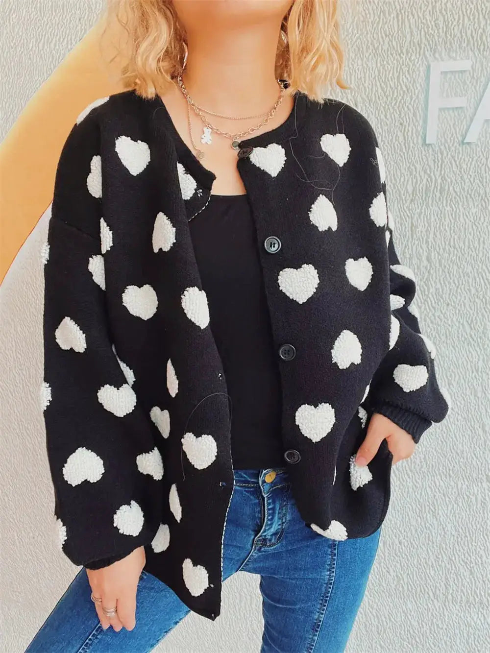 Cozy Heart Button Front Long Sleeve Stretch Knit Cardigan by Trendsi, black knit with white hearts.
