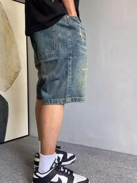 Mens vintage washed distressed denim shorts with gentle stretch in blue denim