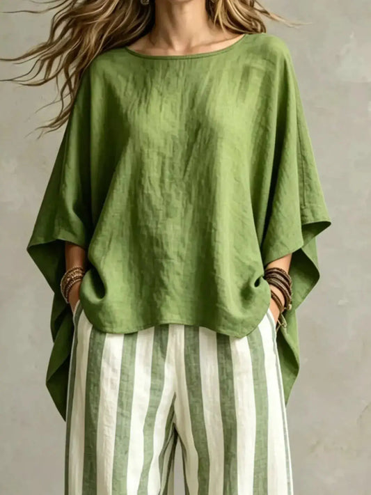 Plus-size top and pants set; olive-green oversized top with wide sleeves paired with green and white striped pants