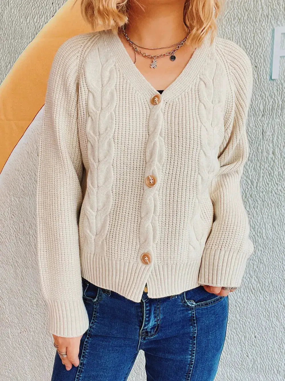 Trendsi soft cable-knit cardigan with V-neck and button front in cream-beige, long sleeves