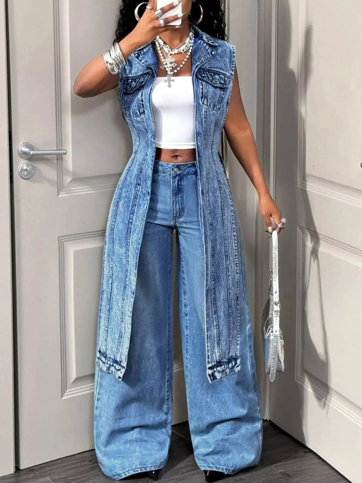 Open-front high-low denim vest with pockets in vintage wash by Trendsi