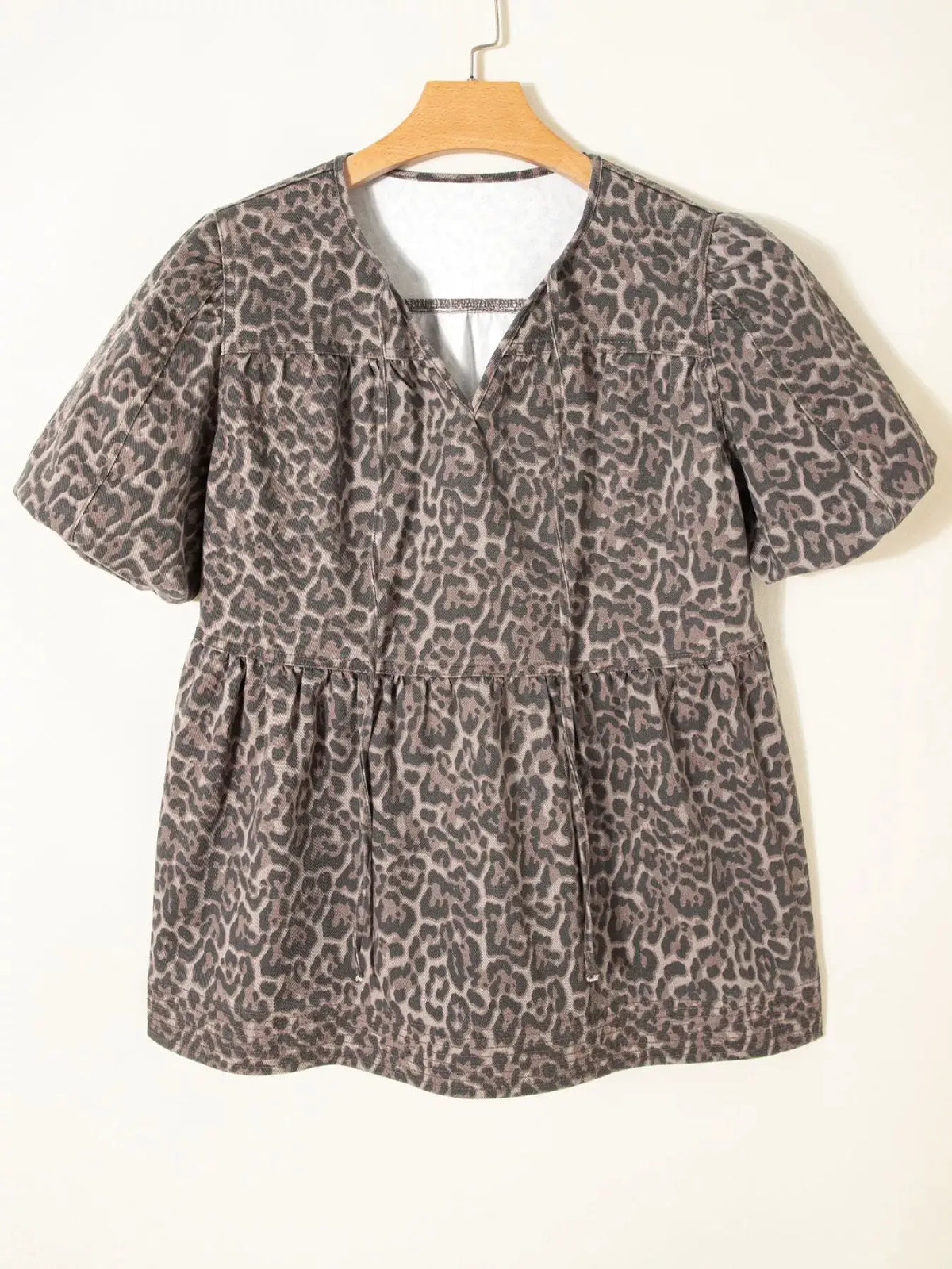 Women's gray leopard-print denim top with puff sleeves and a ruffled hem