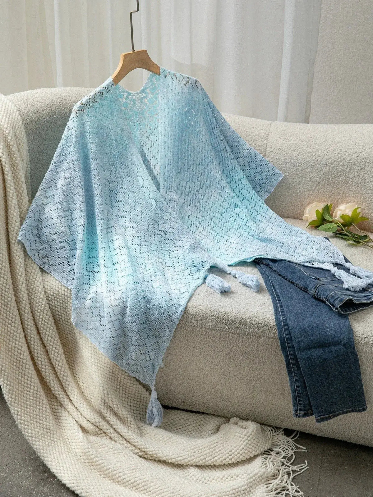 Lightweight gradient openwork knit tassel beach cover-up in blue-to-teal.