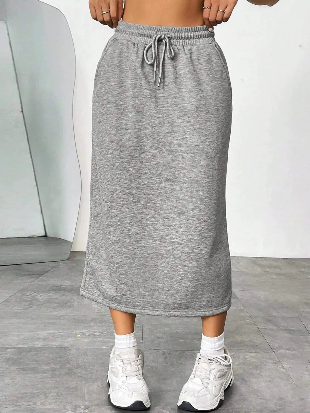 Slit Drawstring Midi Skirt in heather gray knit with elastic waistband.