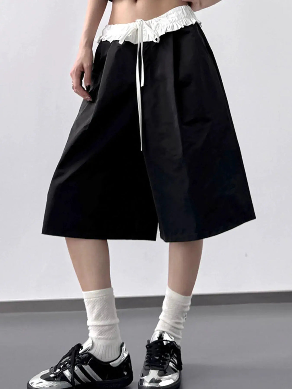 Trendsi black wide-leg shorts with white ruffled waistband and drawstring