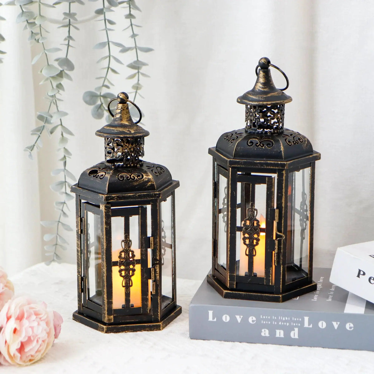 Decorative candle lanterns, 10-inch high vintage metal lanterns (set of 2) with black distressed finish and cutouts.