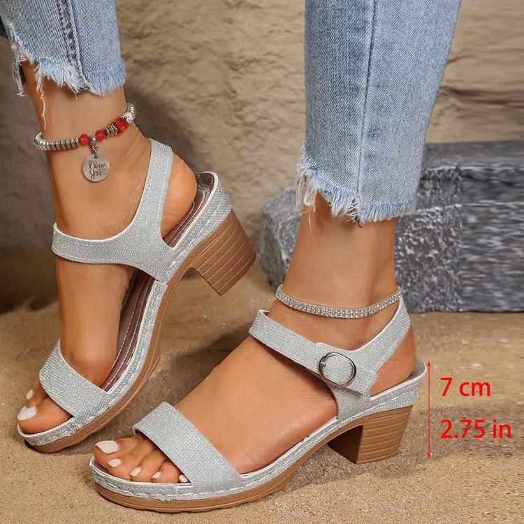 Open-toe sandals by AdTec, buckled ankle strap, silver glitter straps and a wooden chunky heel; pair, 7 cm high.