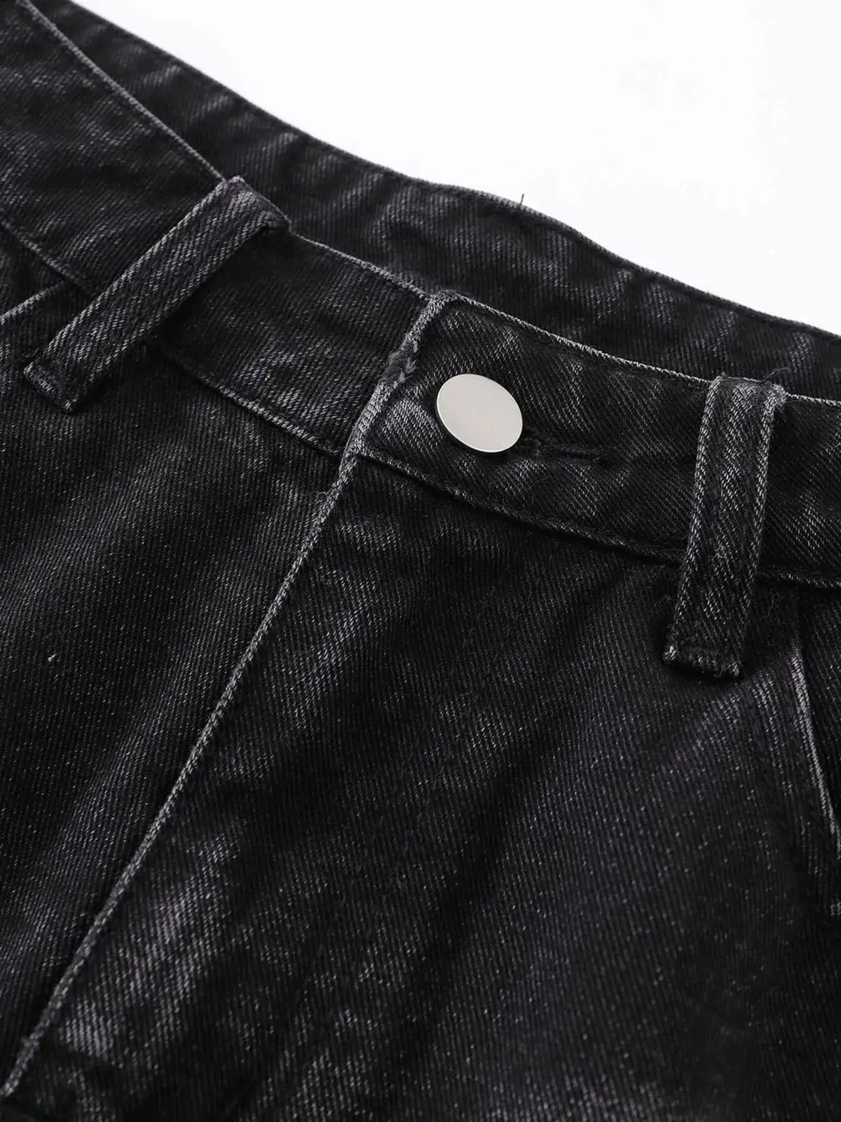 Mens distressed denim shorts close-up of dark indigo denim with silver button and belt loop