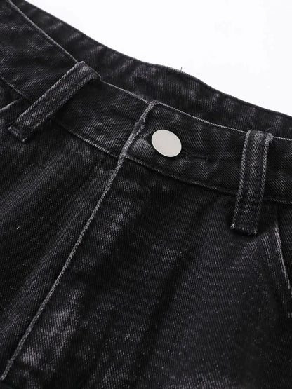 Mens distressed denim shorts close-up of dark indigo denim with silver button and belt loop