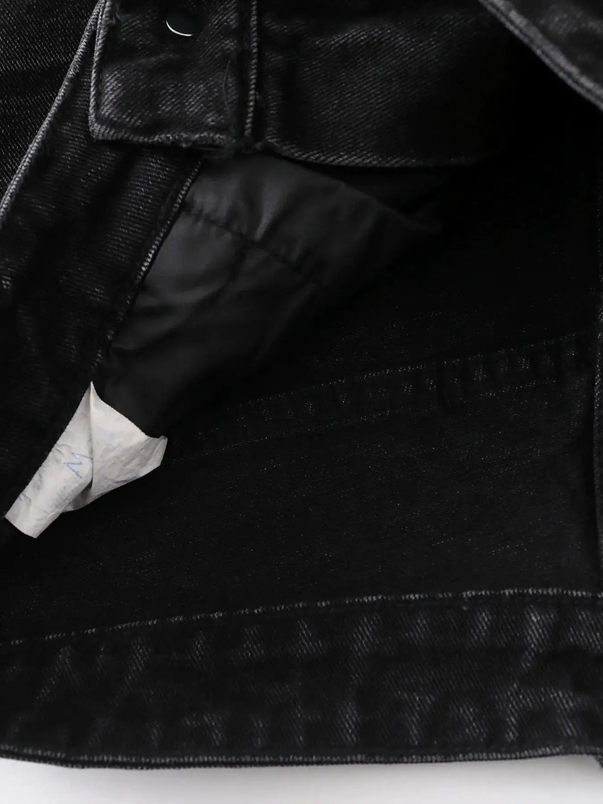 Men's black denim shorts with pocket detail and visible inner lining