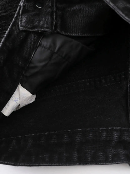Men's black denim shorts with pocket detail and visible inner lining