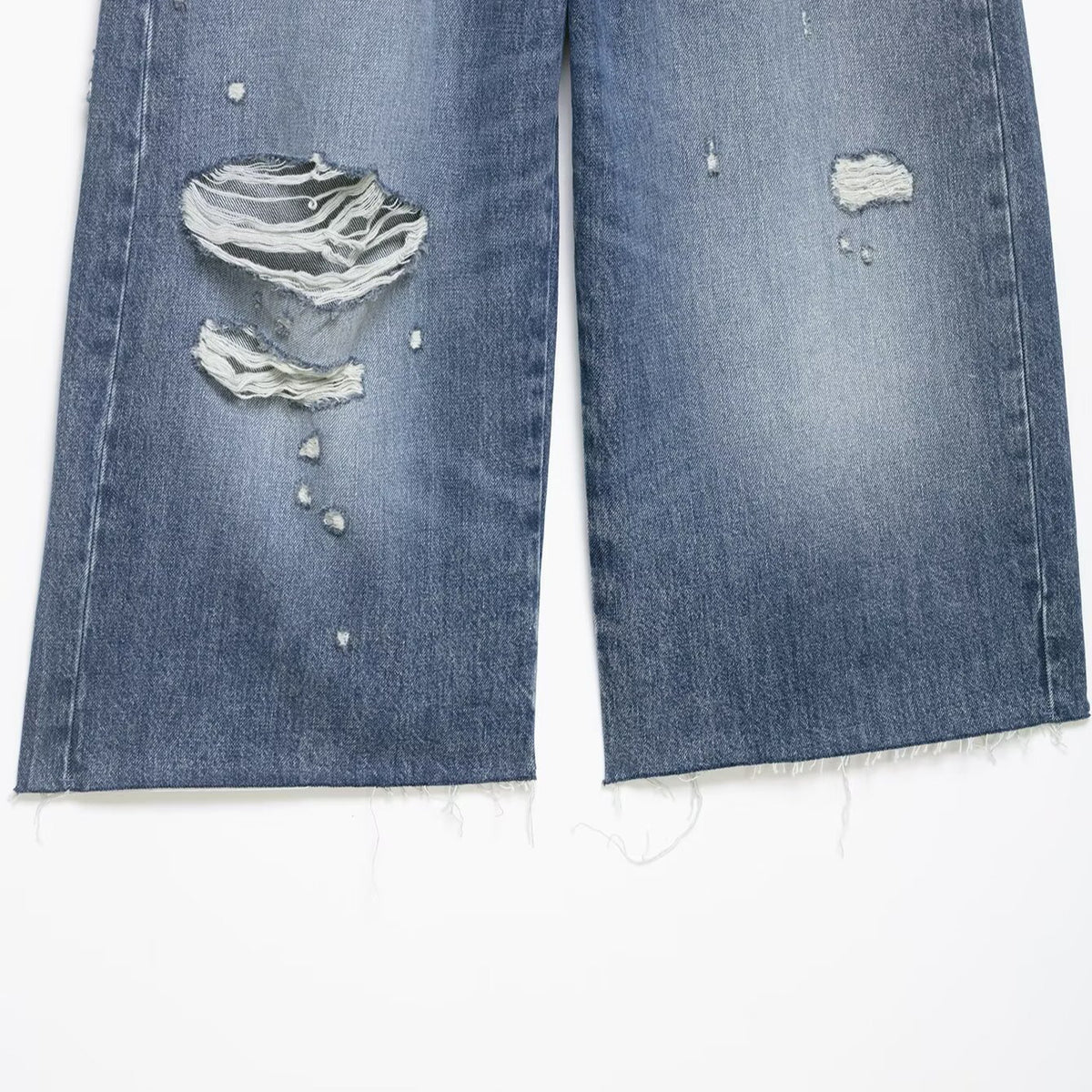 Denim shorts with navy blue color and distressed holes, mid-waist, frayed hems