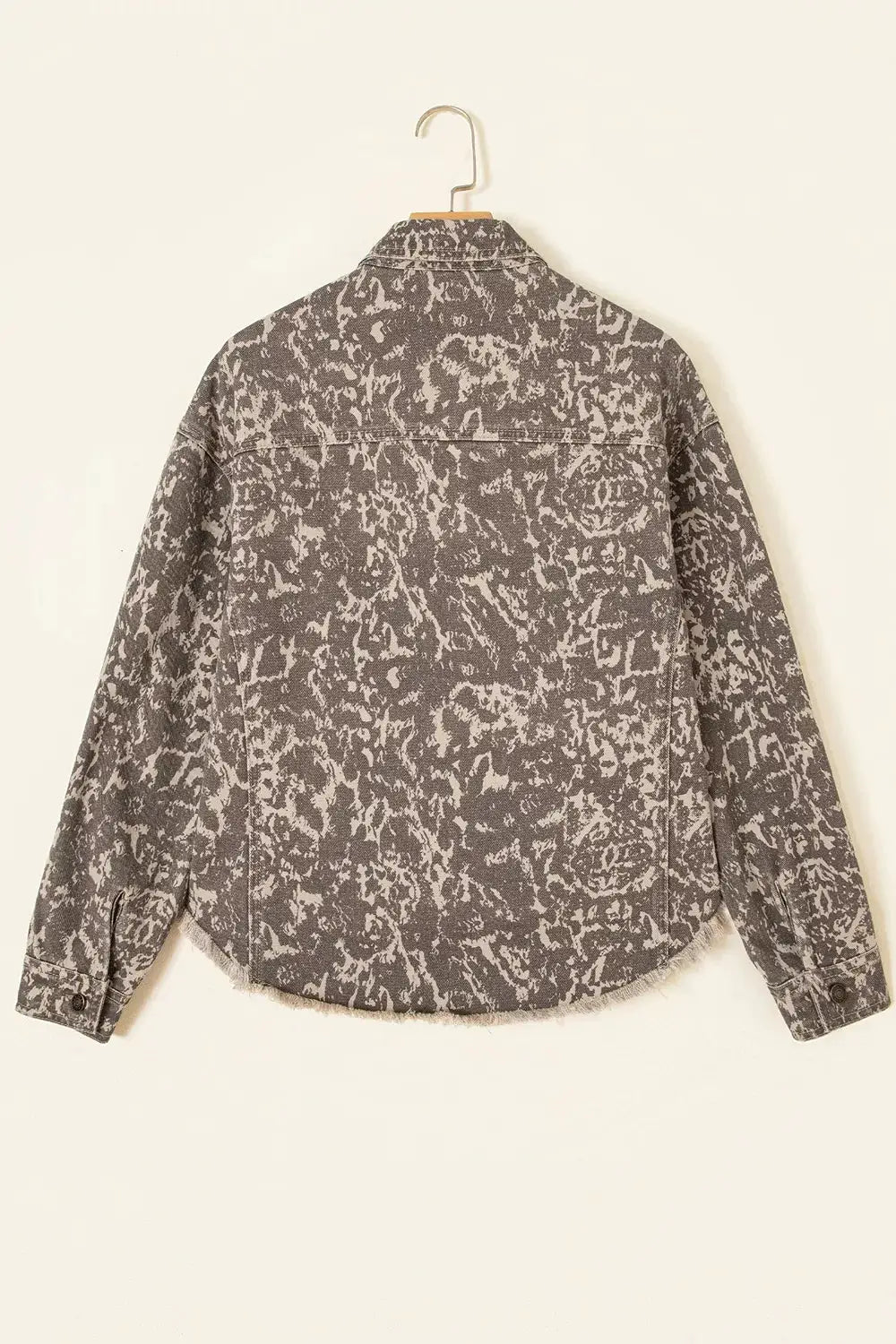 Abstract print long-sleeve denim jacket with a raw hem in grey-black wash