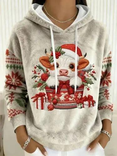 Womens flannel Christmas crew-neck long-sleeve top; beige fuzzy hoodie with festive cow graphic.