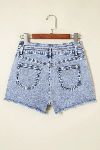 Women's high-waist light-wash denim shorts with raw hem and back pockets