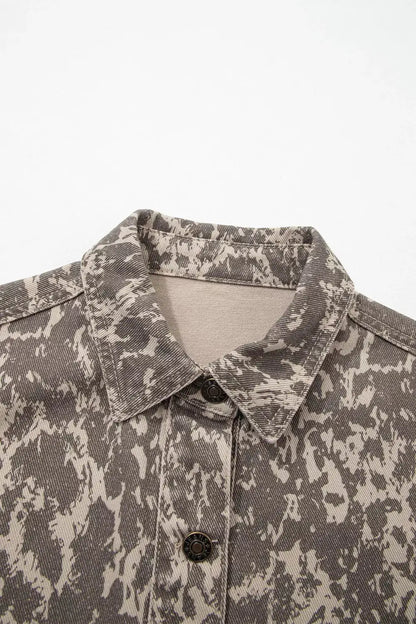 Abstract print denim jacket with gray-beige camo pattern, long sleeves, button-front.