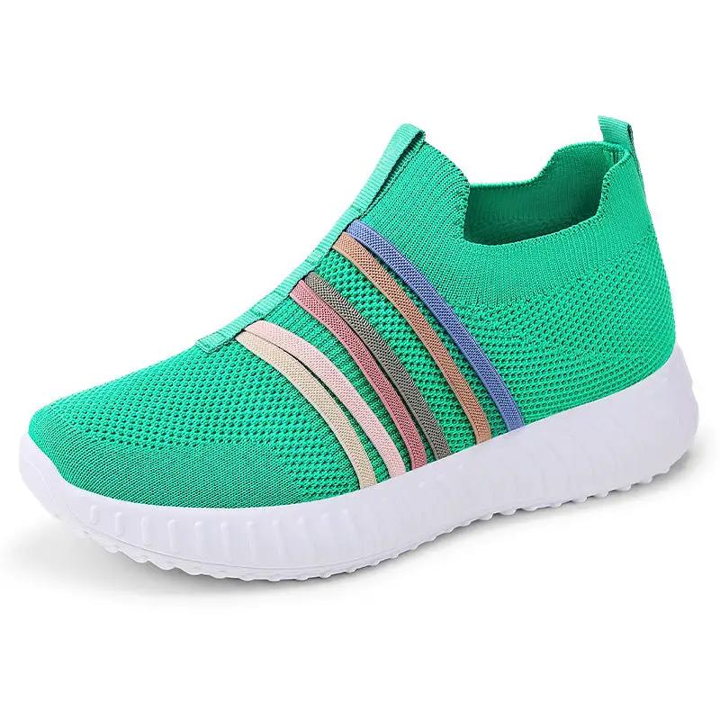 Women's breathable mesh sneakers in teal with multicolor stripe accents and white sole by AdTec.
