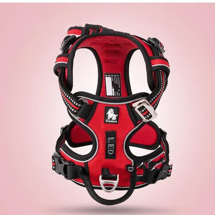 Dog vest-style harness, red with black trim.