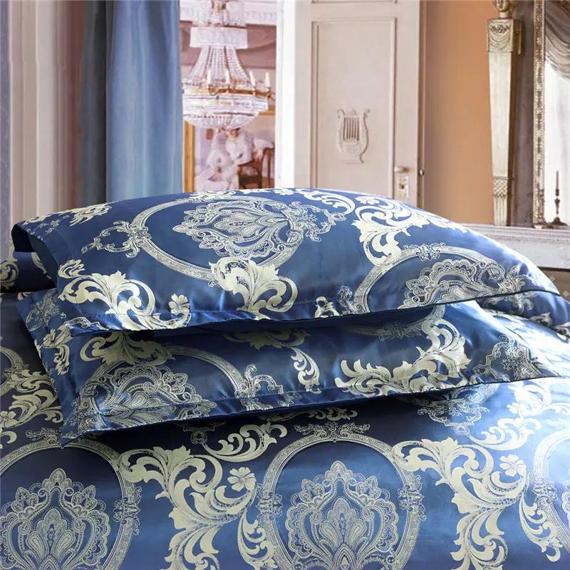 Home textile satin jacquard bedding kit in blue with ornate silver pattern, two pillows stacked.
