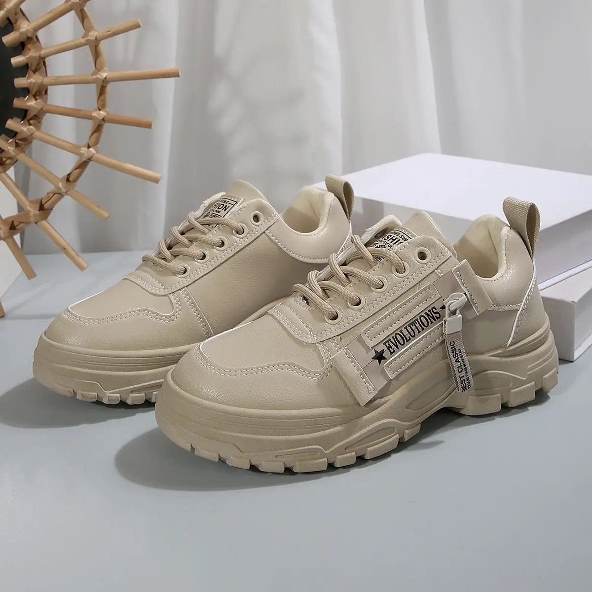 Lace-up women's sneakers with side zipper, beige chunky sole and rounded toe