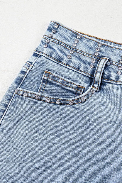 Women’s high-waist rhinestone light-wash denim shorts with a raw hem by Trendsi
