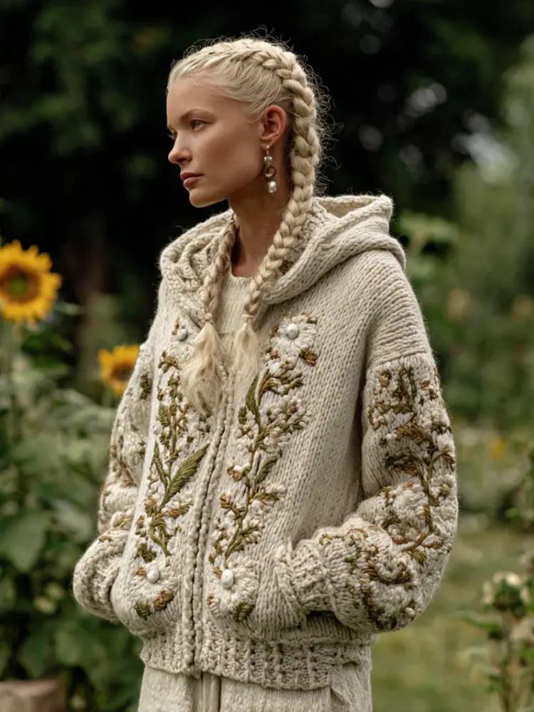 Hooded cream knit cardigan with embroidered floral designs on front and sleeves