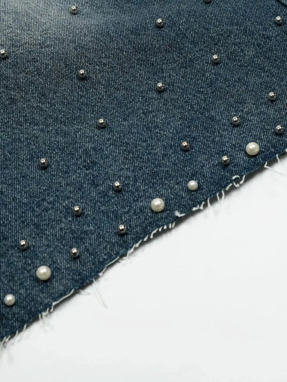 Men's denim shorts with pearl and metallic bead embellishments on dark washed cotton, frayed hem