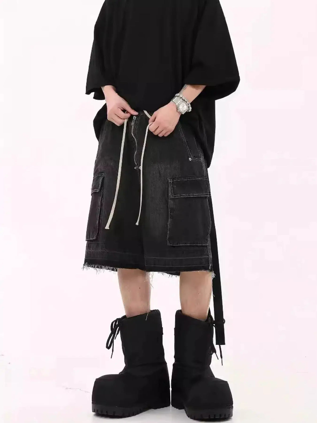 Mens loose-fit black denim cargo shorts with drawstring and front zipper