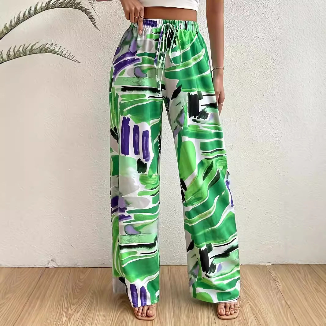 Elastic waist wide-leg pants by eprolo in green, purple, white abstract print